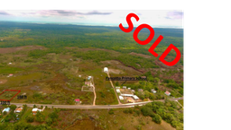 1480.213 square meters of land situate on the eastern side of the Phillip Goldson Highway near mile 18, Sand Hill Village Belize District